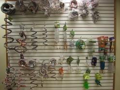 Colorful educational toys and manipulatives arranged on a slatwall display, showcasing various shapes and functions for hands-on learning activities.